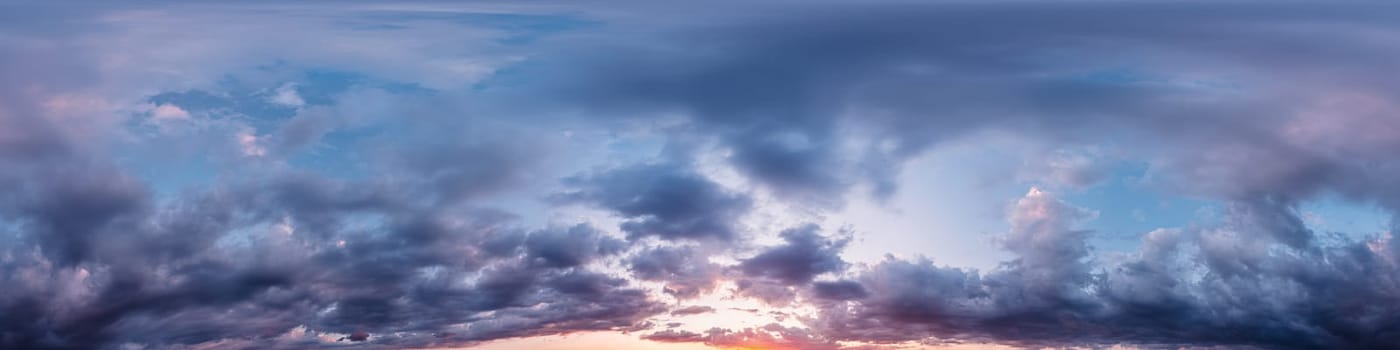 Dramatic Sunset sky 360 panorama. Vibrant sky with bright glowing red pink Cumulus clouds. HDR 360 seamless spherical panorama. Sky dome for aerial drone panoramas. Climate and weather change