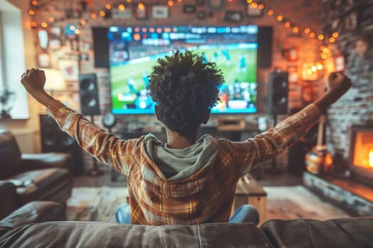 Sports fans cheering during a match at home.