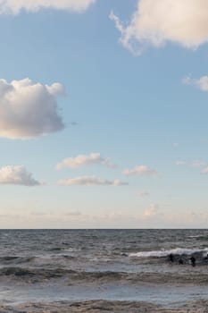 Athletes riding a surfboard on the sea