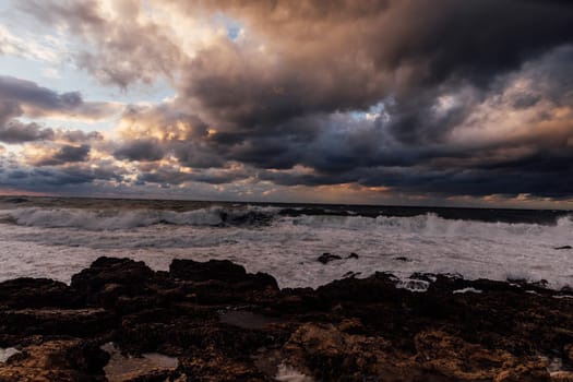 landscape storm on sea and sunset with clouds