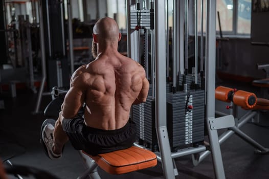 Caucasian man doing rowing exercises on a rowing machine