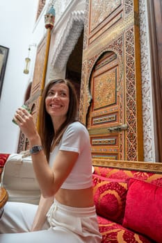 Woman in the courtyard of a riad in Fez, Morocco