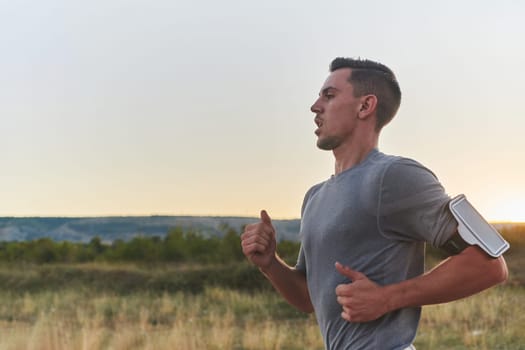 A young handsome man running in the early morning hours, driven by his commitment to health and fitness. High quality photo