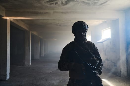 A professional soldier in an abandoned building shows courage and determination in a war campaign.