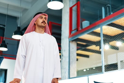 Successful muslim businessmen in traditional outfit in his office, portrait