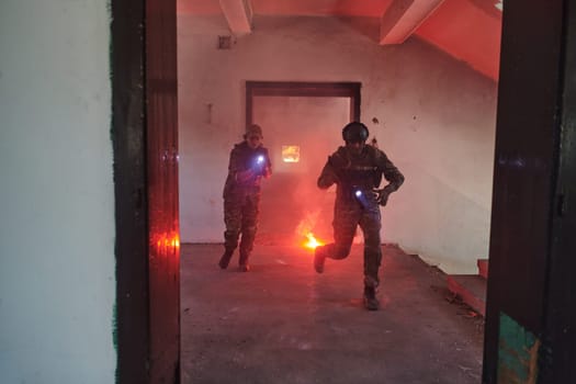 A group of professional soldiers bravely executes a dangerous rescue mission, surrounded by fire in a perilous building