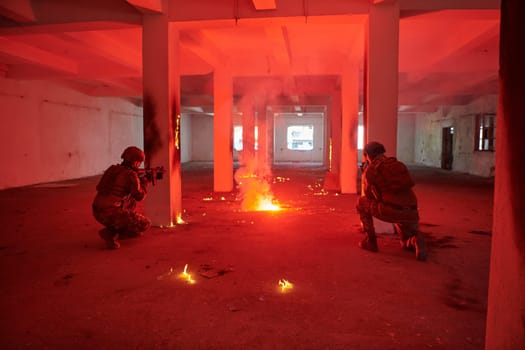 A group of professional soldiers bravely executes a dangerous rescue mission, surrounded by fire in a perilous building