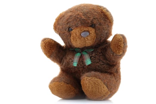 A Brown Teddy Bear with tartan bow