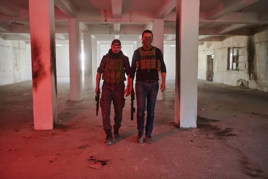 An abandoned building serves as the stronghold for a team of terrorists, fiercely guarding their occupied territory with guns and military equipment.