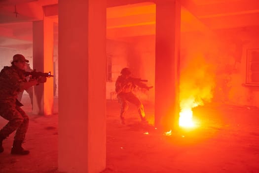 A group of professional soldiers bravely executes a dangerous rescue mission, surrounded by fire in a perilous building