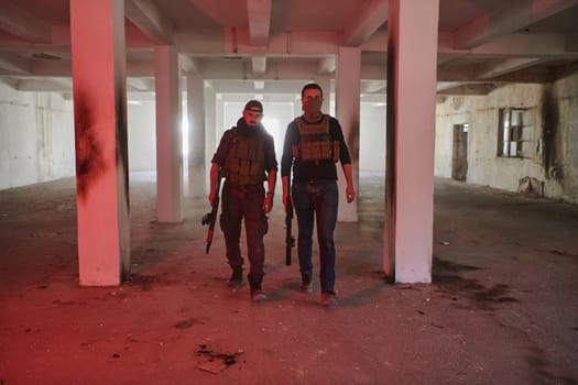 An abandoned building serves as the stronghold for a team of terrorists, fiercely guarding their occupied territory with guns and military equipment.