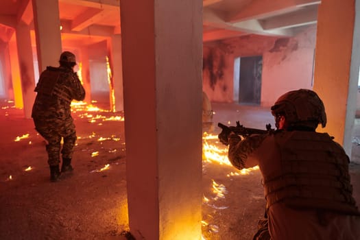 A group of professional soldiers bravely executes a dangerous rescue mission, surrounded by fire in a perilous building