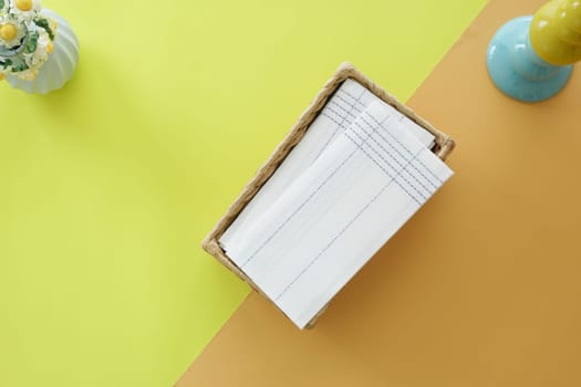 top view of tissue in a box on a color background .