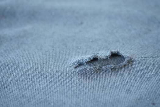 hole in the clothes. Close-up