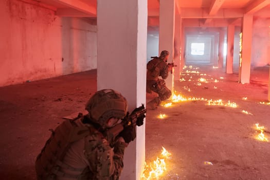 A group of professional soldiers bravely executes a dangerous rescue mission, surrounded by fire in a perilous building