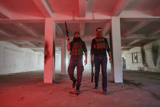 An abandoned building serves as the stronghold for a team of terrorists, fiercely guarding their occupied territory with guns and military equipment.