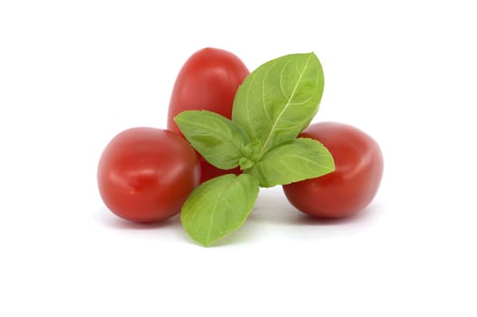 Close-up of fresh Roma tomatoes, alongside basil leaves on a white background. Perfect for illustrating healthy eating and fresh ingredients.