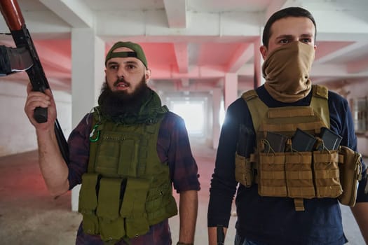 An abandoned building serves as the stronghold for a team of terrorists, fiercely guarding their occupied territory with guns and military equipment.