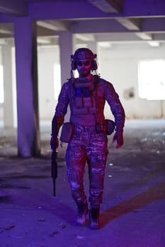 A professional soldier undertakes a perilous mission in an abandoned building illuminated by neon blue and purple lights.