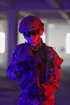 A professional soldier undertakes a perilous mission in an abandoned building illuminated by neon blue and purple lights.