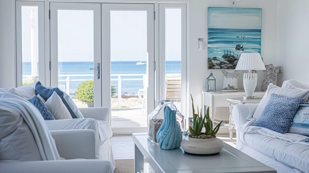 Interior of a living room with white walls, sofa and cushions. Sitting room in coastal cottage with sea view. Luxury lounge room