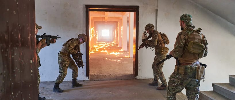 A group of professional soldiers bravely executes a dangerous rescue mission, surrounded by fire in a perilous building