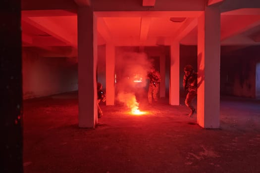 A group of professional soldiers bravely executes a dangerous rescue mission, surrounded by fire in a perilous building