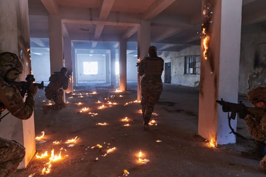 A group of professional soldiers bravely executes a dangerous rescue mission, surrounded by fire in a perilous building