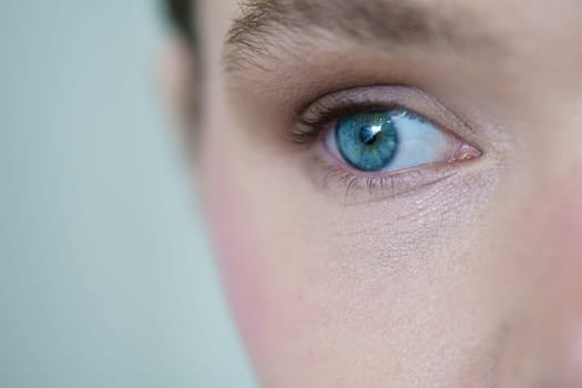 Close-up portrait of a beautiful caucasian girl with blue eyes