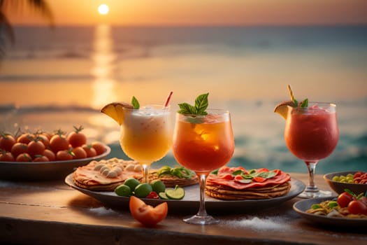 cold cocktails on the table and snacks, on the seashore in the evening .