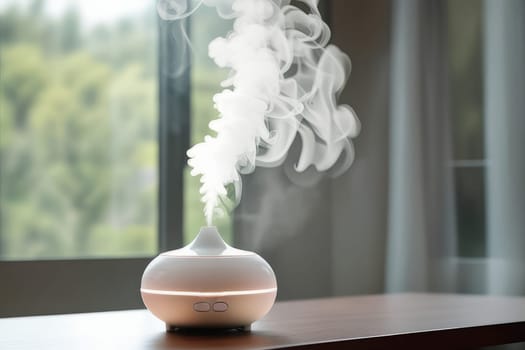 Aroma oil white glass diffuser with rising steam flow on table by window