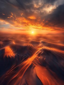 Twilight descends upon the desert, with the sun casting its final golden rays over a landscape of fluid sand waves. The sky becomes a canvas of orange and red, reflecting the desert's fiery essence