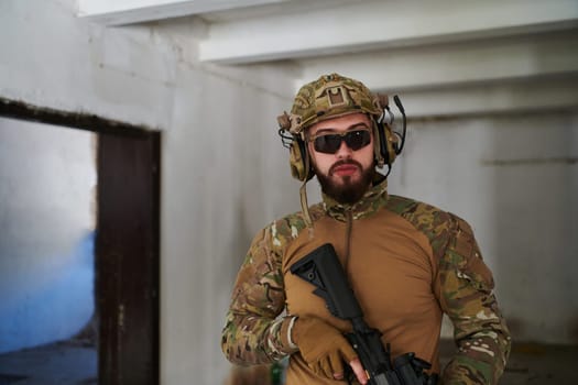 Modern warfare soldier portrait in urban environment.