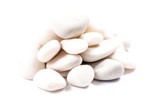 A pile of white rocks stacked on top of each other. Concept of stability and strength, as the rocks are stacked in a way that creates a solid foundation