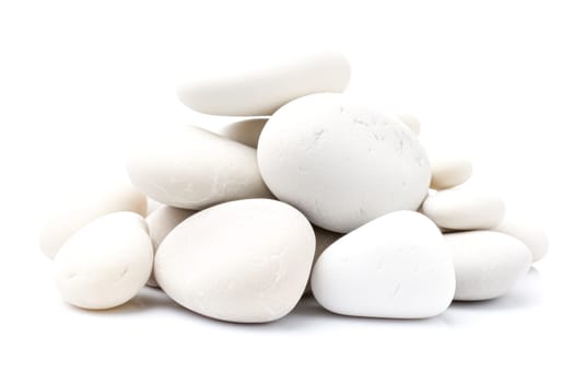 A pile of white rocks stacked on top of each other. Concept of stability and strength, as the rocks are stacked in a way that creates a solid foundation