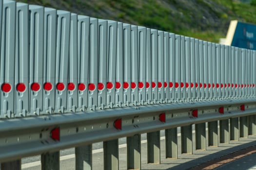 Safety barriers on highway. Anodized safety steel barrier. Enhancing highway safety