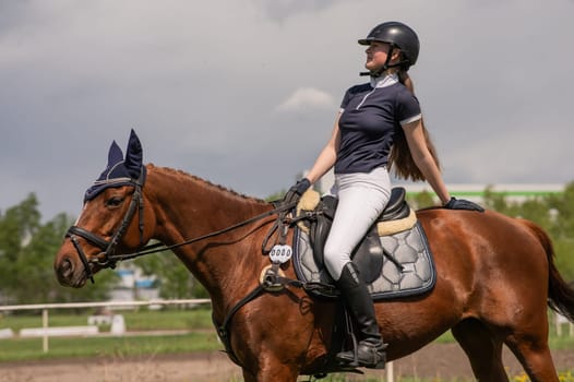 A young girl goes in for horseback riding