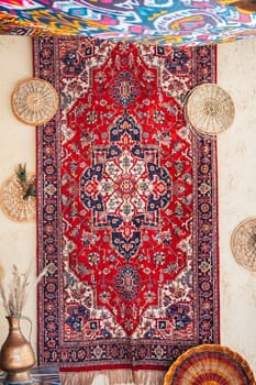 vintage traditional Arabic red handmade carpet at the oriental bazaar in Uzbekistan in Tashkent