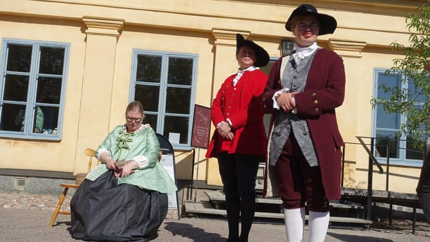 Uppsala, Sweden, May 18, 2024. A day at the Linnaeus Garden Party. 1700s theme. Sitting.