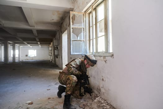 A professional soldier carries out a dangerous military mission in an abandoned building.