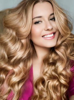 Beautiful blonde woman with curly volume hairstyle, long luxurious hair and beauty makeup, glamorous look face portrait for luxury fashion and natural cosmetics idea