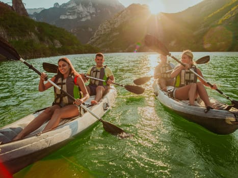 A group of friends enjoying fun and kayaking exploring the calm river, surrounding forest and large natural river canyons during an idyllic sunset