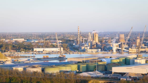 Aerial view of the industrial and port area of Ravenna ,chemical and petrochemical pole,thermoelectric,metallurgical plants and hydrocarbon refinery and liquefied natural gas tanks