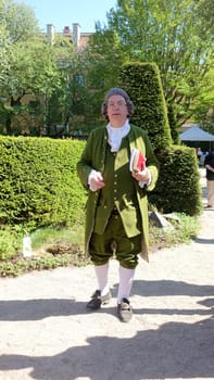 Uppsala, Sweden, May 18, 2024. A day at the Linnaeus Garden Party. 1700s theme. Book.