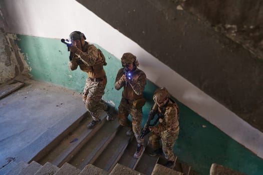 A group of professional soldiers bravely executes a dangerous rescue mission, surrounded by fire in a perilous building