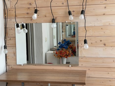 make-up mirror with bulbs a nd flowers