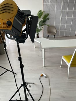 Interior of a white photo studio with spotlights