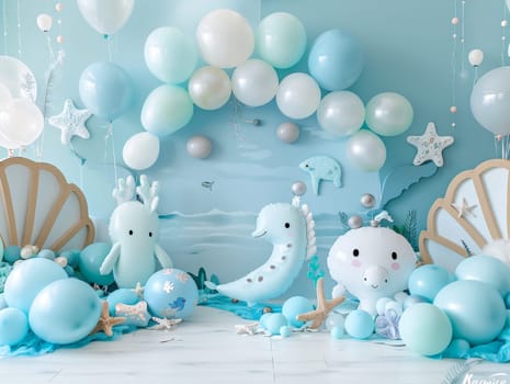 A blue and white room with a blue archway and a blue background. The archway is filled with balloons and there are several stuffed animals, including a whale and a dolphin