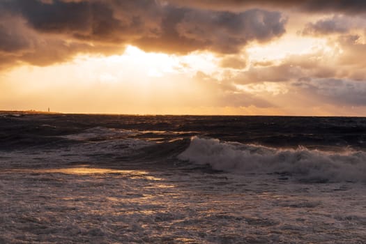 landscape storm on sea and sunset with clouds