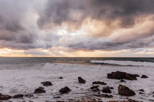 landscape storm on sea and sunset with clouds